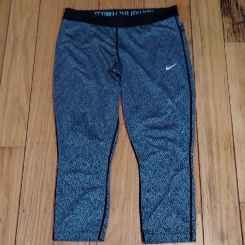 Nike Drifit blue and black leopard print leggings with waist band zipper Sz L